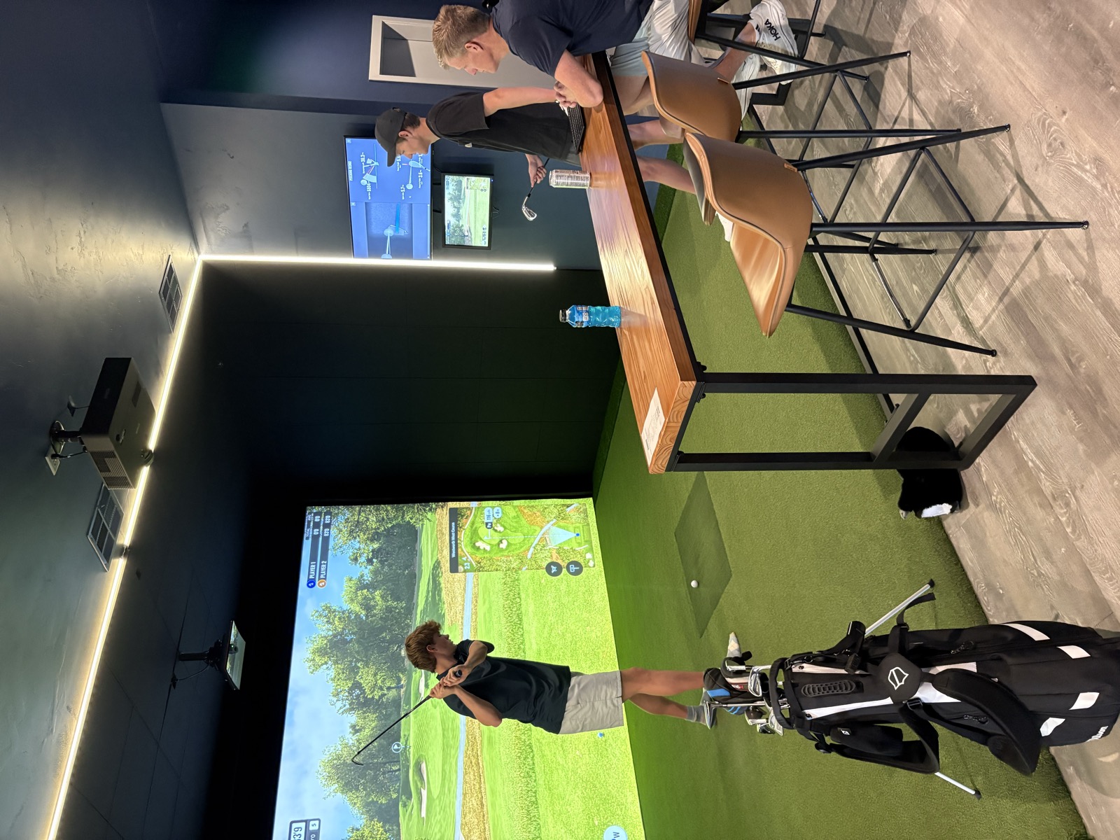 Young golfer swinging at Crushers